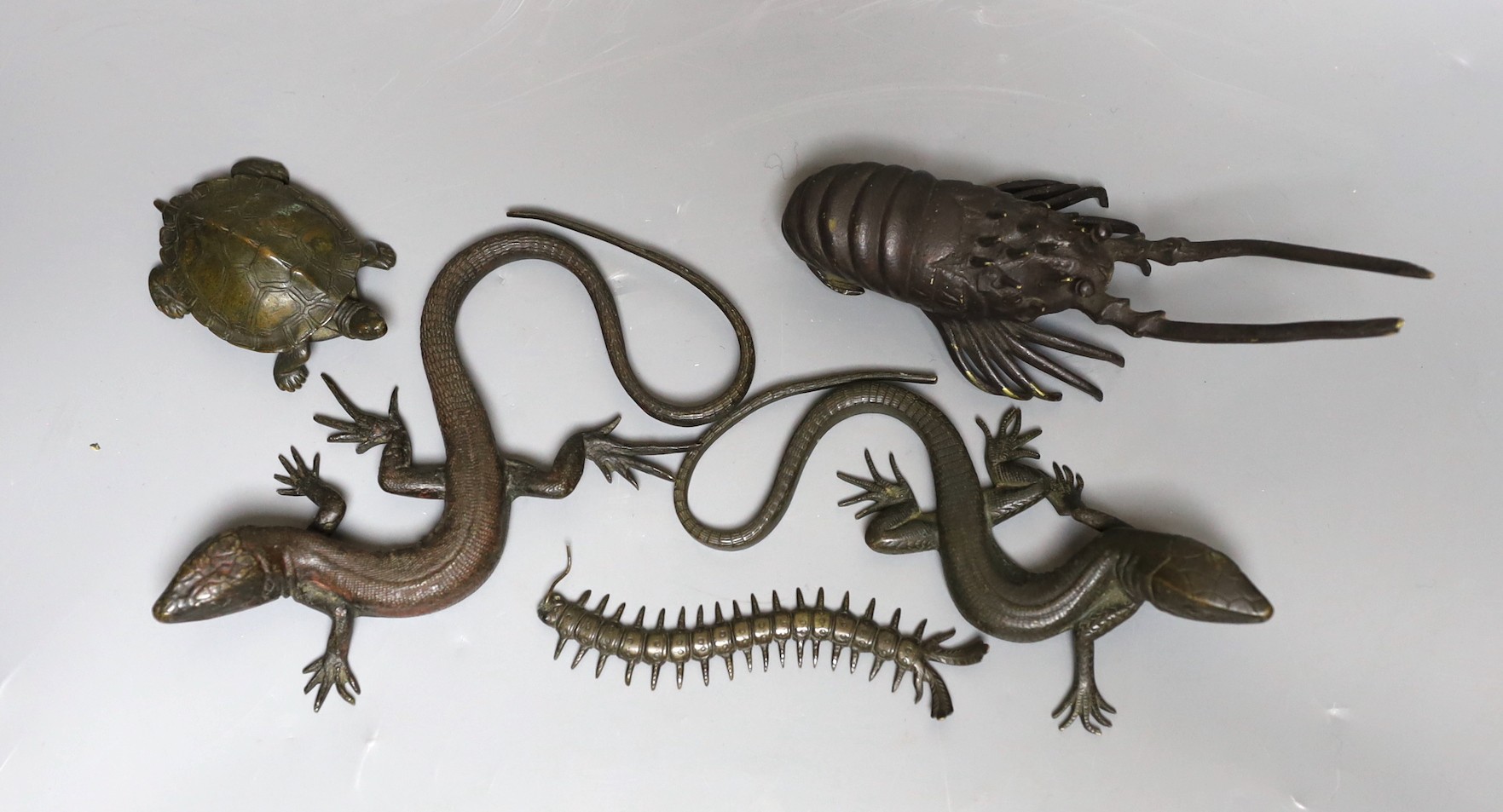 A group of bronze figures of two lizards, a centipede, a tortoise, and a crayfish, latter 16cm wide (5)